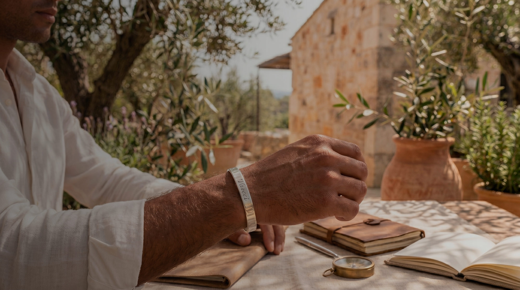 VARCCI sterling silver cuff held in a Milanese atelier